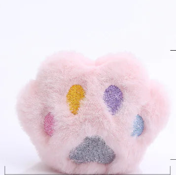 Color swatches on a pink paw pad with various colored dots.