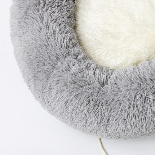Gray fluffy pet bed on a white background