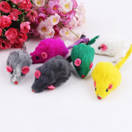 Colorful mouse-shaped toys with pink ears on a white background with flowers.