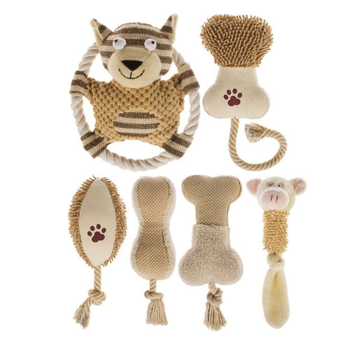 Set of baby toys including a monkey rattle, textured ball, and other items on a white background