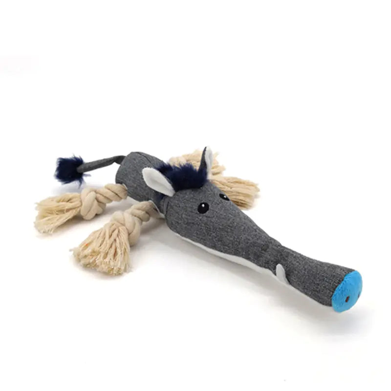 Gray elephant toy with braided legs on a white background