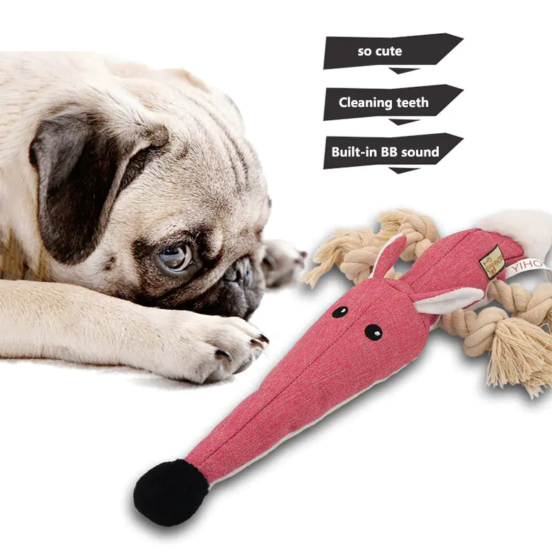 Dog playing with a pink toy resembling a bone, with text describing features.