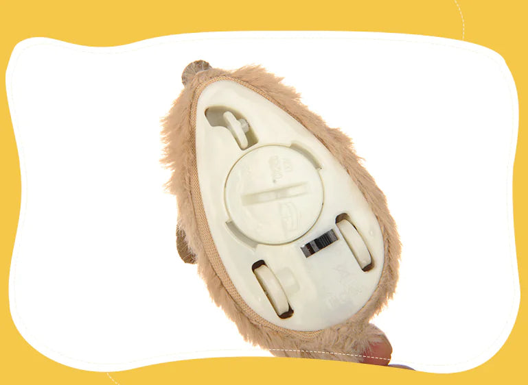 Plush lion-shaped remote control on a yellow background