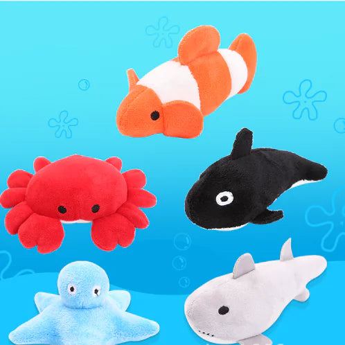 Set of plush ocean animals on a blue background with underwater patterns.