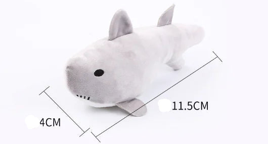 Plush shark toy with measurements on a white background
