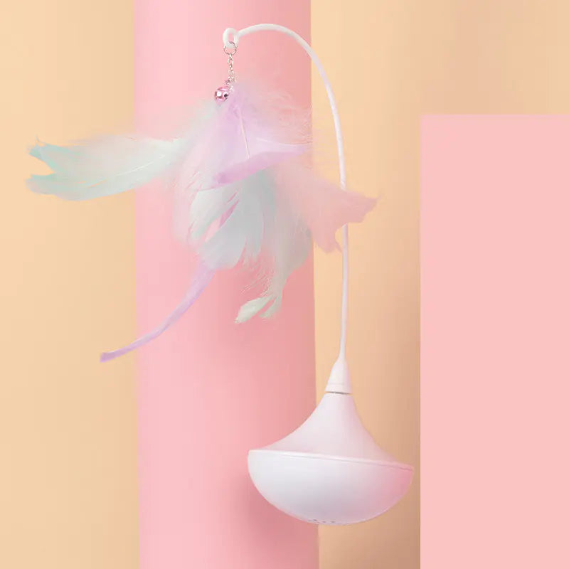 Pastel-colored ceiling light fixture with decorative wings on a pink and yellow background