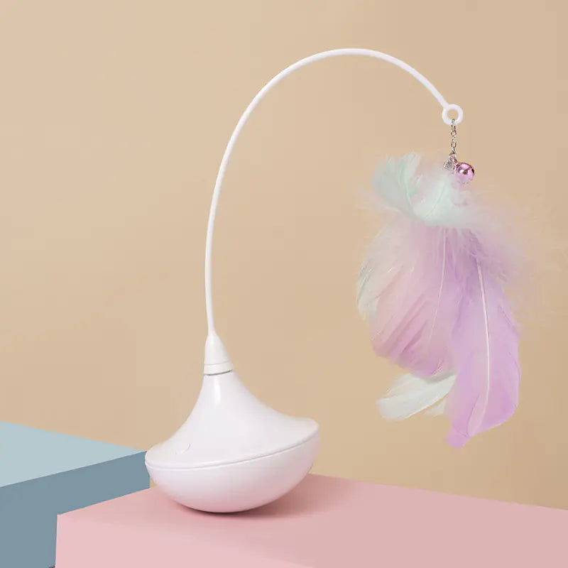 White lamp with a decorative feather charm on a beige background
