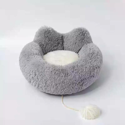 Gray fluffy pet bed on a white background