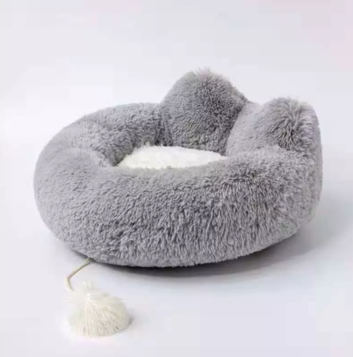 Gray fluffy pet bed on a white background