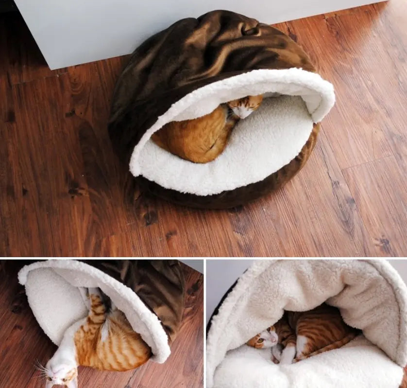 Cat lying inside a brown and white pet bed on a wooden floor.